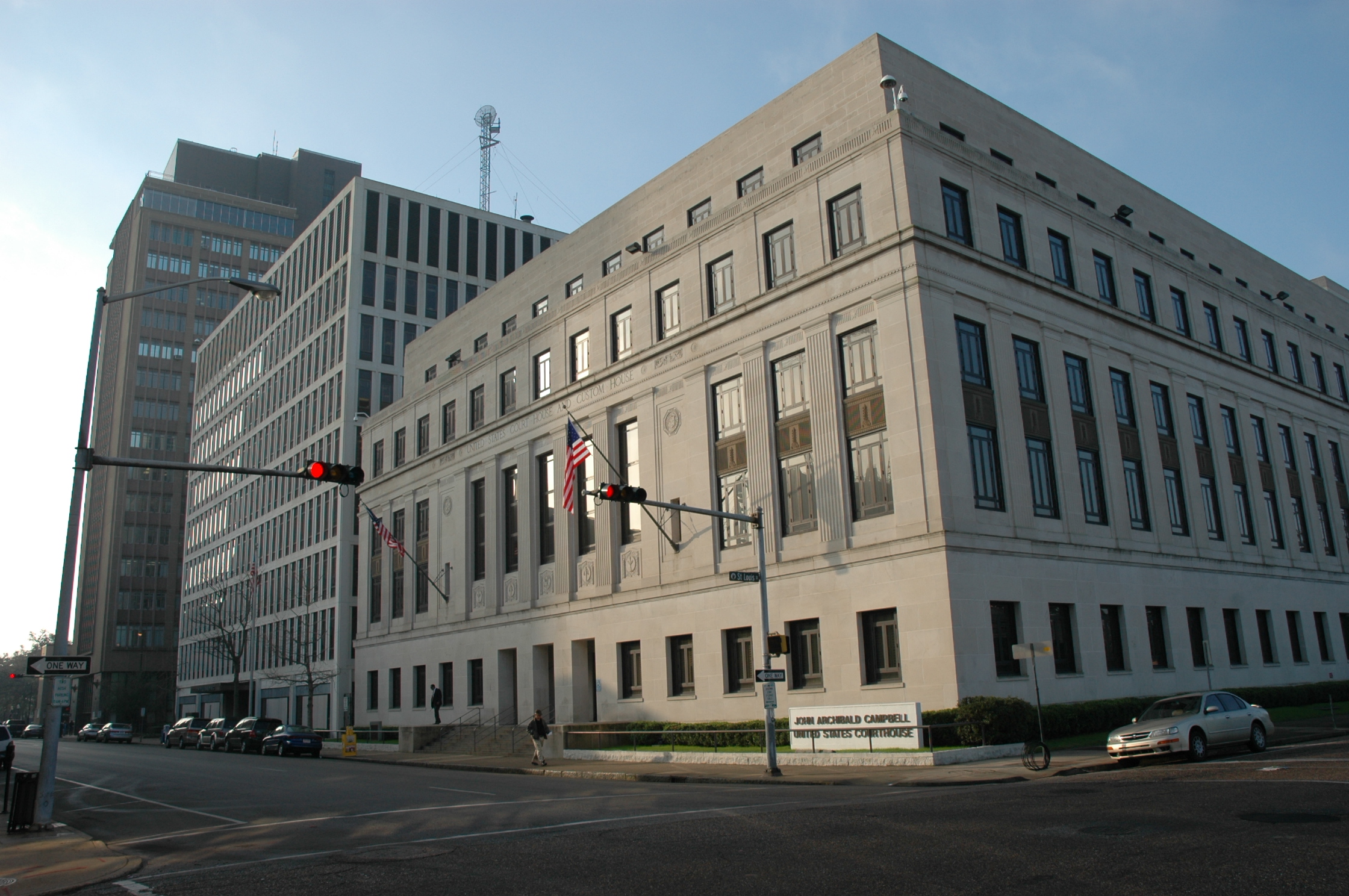The Courthouse in Mobile, Alabama is a white, limestone building resting on a granite base, built in the relatively austere Neo-Classical Revival style.